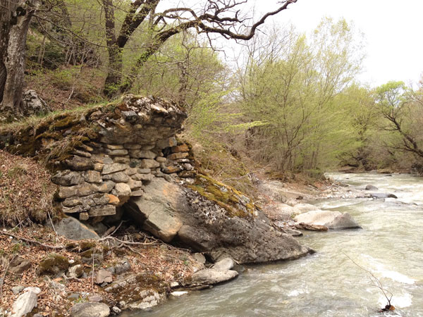 Medieval bridge foundation near Rkoni Monastery, seen on John Graham Tours.