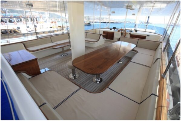 John Graham Tours Castles of Caria cruising tour. Image of a table and chairs about a gulet charter boat.