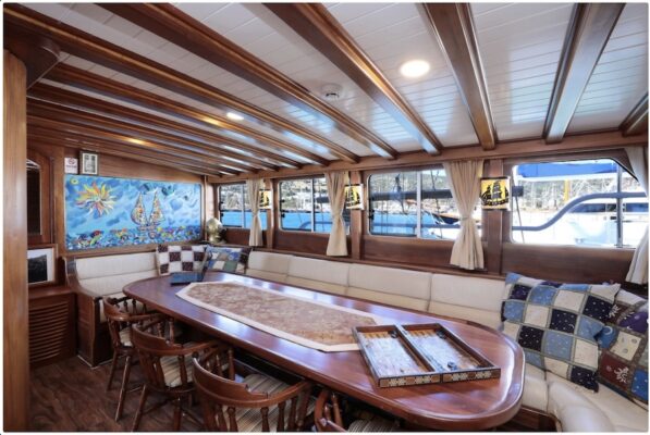 John Graham Tours Castles of Caria cruising tour. Image of a table and chairs on a gulet charter boat.