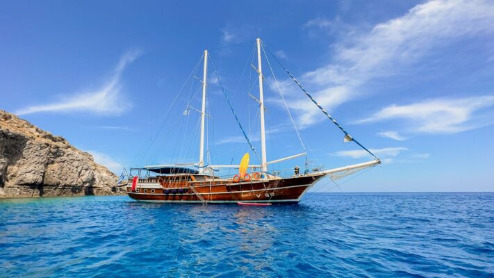 John Graham Tours, Castles of Caria archeological tour. Image of a gulet charter boat on a blue sea.